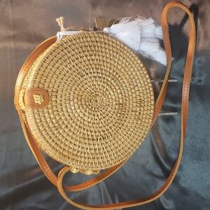 Handcrafted in Vietnam woven round purse with leather strap